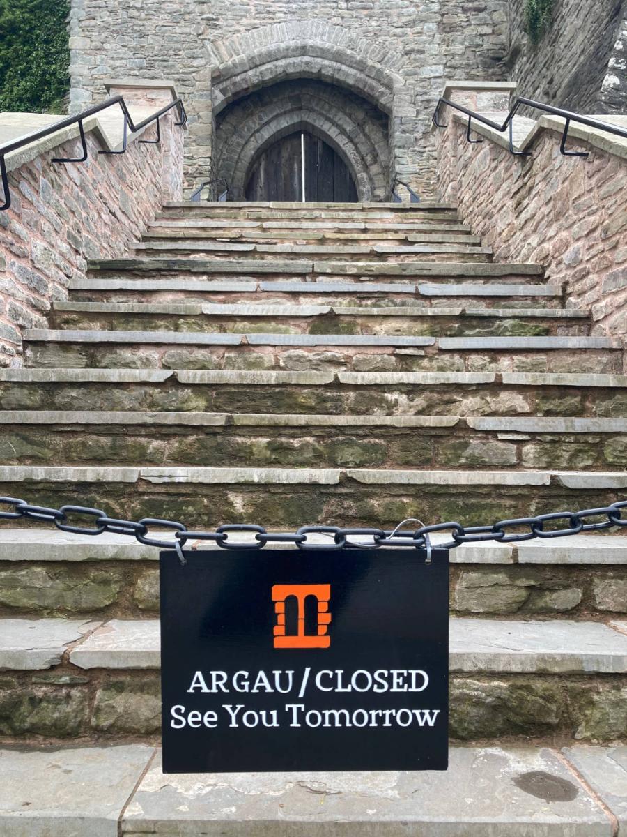 image shows: Closed sign for Hay on Wye Castle in Wales